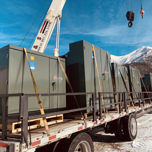 The truck is loaded with Pad Mounted transformers.
